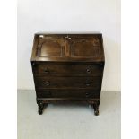A REPRODUCTION OAK FINISH THREE DRAWER WRITING BUREAU WITH FITTED INTERIOR,