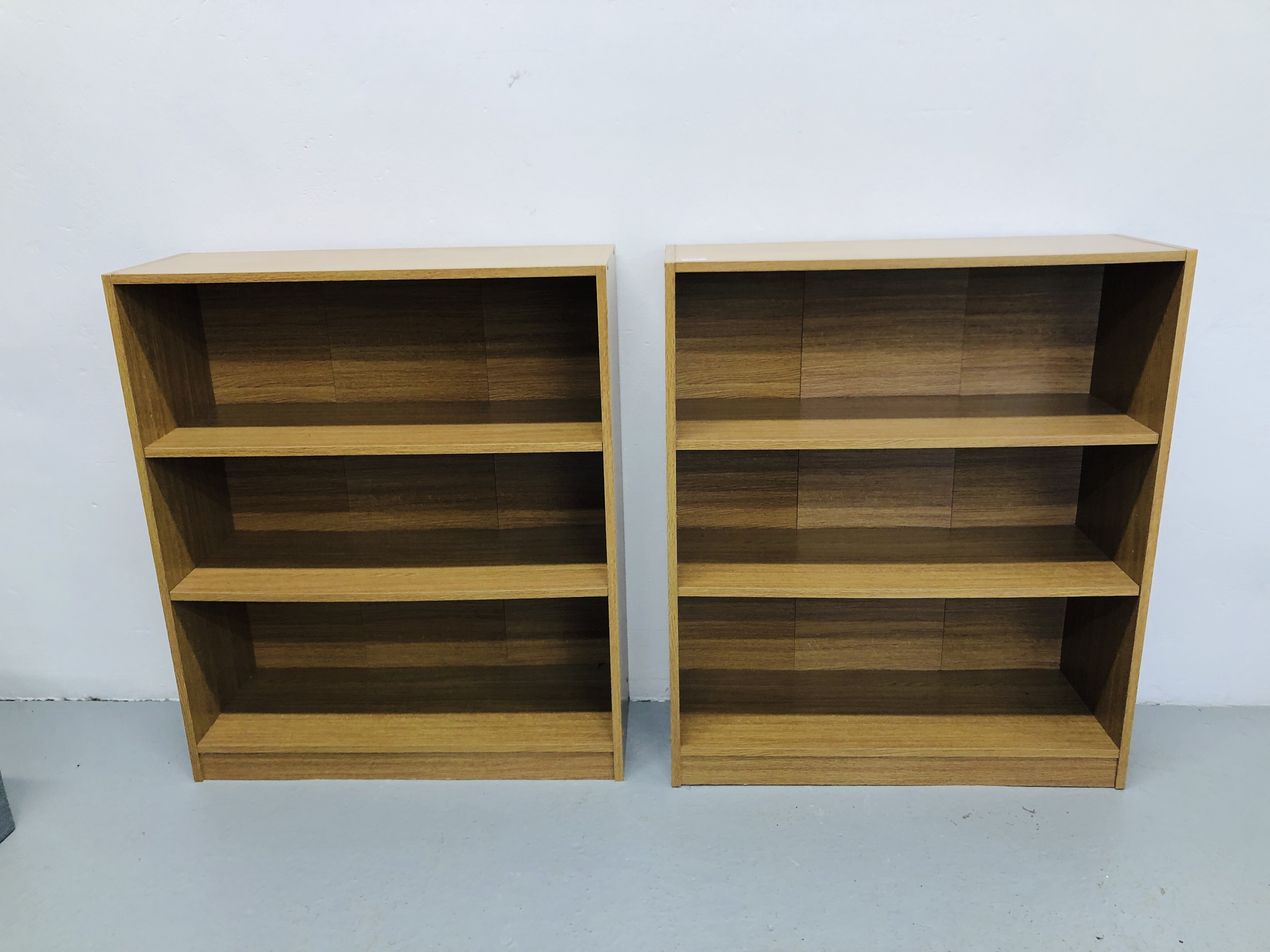 A APIR OF MODERN BEECH FINISH THREE TIER SHELVES