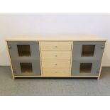 MODERN BEECHWOOD FINISH DRESSER BASE THE FOUR CENTRAL DRAWERS FLANKED BY TWO CABINETS WITH GLASS