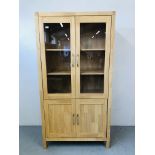 A MODERN BEECHWOOD FULL HEIGHT CABINET THE TOP TWO GLAZED DOORS ABOVE CABINET BASE HEIGHT 75 INCH,