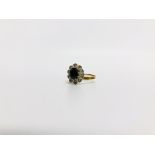 AN 18CT GOLD ENGAGEMENT RING THE CENTRAL SAPPHIRE SURROUNDED BY TEN SMALL DIAMONDS