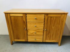 A HONEY PINE DRESSER BASE THE FOUR CENTRAL DRAWERS FLANKED BY TWO CABINETS LENGTH 47 INCH,