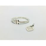 A SILVER TIFFANY & CO HINGED BANGLE AND A SILVER HEART PENDANT MARKED TIFFANY & CO