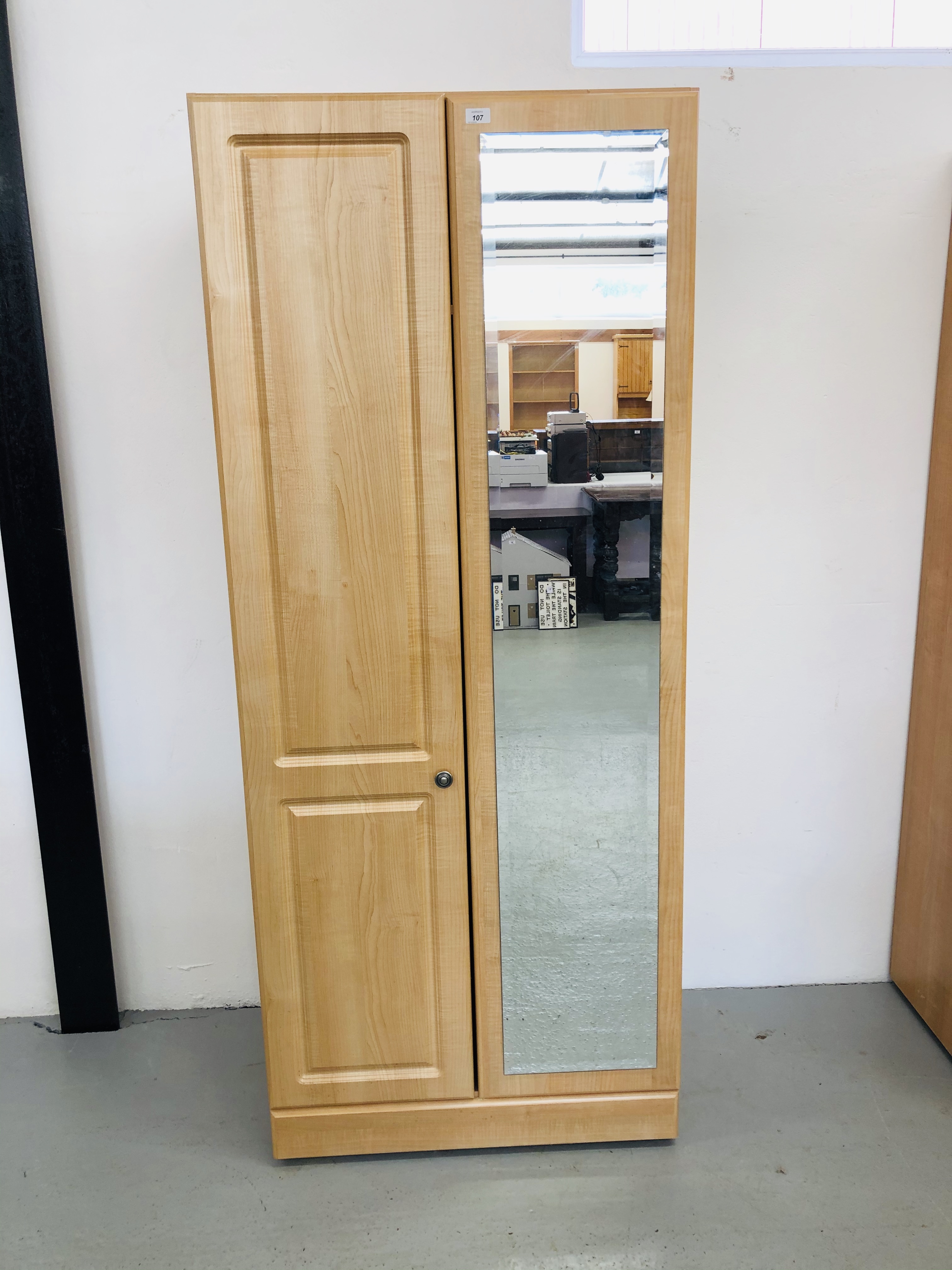 A MODERN TWO DOOR LIMED FINISH WARDROBE WITH MIRROR TO ONE DOOR WIDTH 80CM. HEIGHT 192CM.