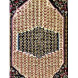 AN EASTERN HAND WOVEN TRADITIONAL RUG 140CM. X 110CM.