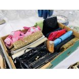 A BOX CONTAINING A COLLECTION OF TWENTY ONE VARIOUS LADIES FASHION CLUTCH AND HANDBAGS TO INCLUDE