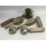 A SILVER FOUR PIECE BRUSH AND MIRROR SET