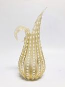 A MID C20TH FLUTED JUG OF SINUOUS DESIGN