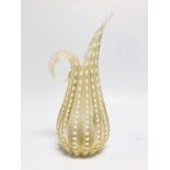 A MID C20TH FLUTED JUG OF SINUOUS DESIGN