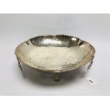 A SHALLOW WHITE METAL FRUIT BOWL STANDIN