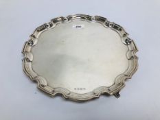 A SILVER SALVER HAVING A PIE CRUST RIM O