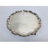 A SILVER SALVER HAVING A PIE CRUST RIM O