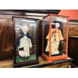 TWO JAPANESE DOLLS IN GLASS CASES, C.192