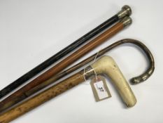 FOUR SILVER MOUNTED WALKING STICKS