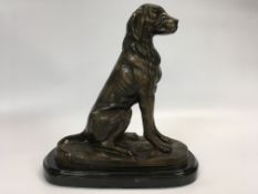 A MODERN BRONZE OF A SEATED LABRADOR ON