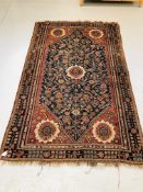 PERSIAN RUG, BLUE FIELD WITH A FLOWER H