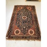 PERSIAN RUG, BLUE FIELD WITH A FLOWER H