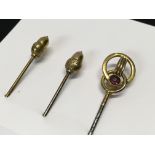 TWO 9CT. GOLD ACORN HAT PINS AND ONE OTH