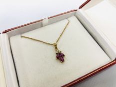 A 9CT GOLD CHAIN WITH THREE STONE RUBY P