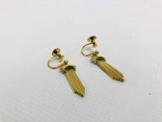 A PAIR OF MIDDLE EASTERN YELLOW METAL DR