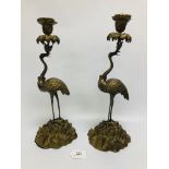 A PAIR OF GILT METAL CRANE CANDLESTICKS