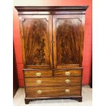 A GEORGE III MAHOGANY LINEN PRESS, DOUBL