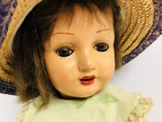 VINTAGE COMPOSITE DOLL DRESSED IN A FLOR