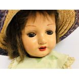 VINTAGE COMPOSITE DOLL DRESSED IN A FLOR