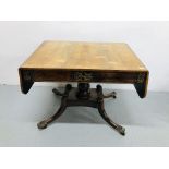 A REGENCY ROSEWOOD PEDESTAL TABLE THE TOP HAVING DROP LEAVES THE FREEZE HAVING TWO DRAWERS WITH