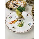 A PLATE DECORATED WITH AN EXOTIC BIRD BEARING GOLD ANCHOR MARK,