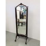 A MAHOGANY CHEVAL MIRROR WITH SHAPED AND BEVELLED GLASS