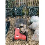 A MOUNTFIELD PETROL DRIVEN GARDEN MACHINE MODEL 00035354 - SOLD AS SEEN