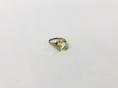 A LADIES DRESS RING MARKED 9CT SET WITH PERIDOT GEM STONE