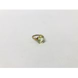 A LADIES DRESS RING MARKED 9CT SET WITH PERIDOT GEM STONE