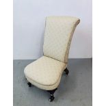 A VICTORIAN NURSING CHAIR WITH WALNUT SCROLLED FORLEG ON CERAMIC CASTERS UPHOLSTERED IN A LEMON