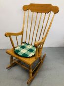 A STICK BACK PINE ROCKING CHAIR