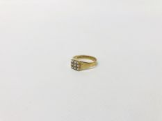 A 9CT GOLD GENTLEMAN'S RING SET WITH NINE CZ STONES