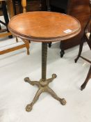 A VICTORIAN READING STAND WITH ALTERNATIVE CIRCULAR TOP ON IRON BASE