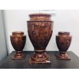 A LARGE PAIR OF BROWN GLAZED VASES AND ONE MATCHING LARGER,