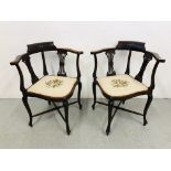 A PAIR OF MAHOGANY CORNER CHAIRS WITH STRUNG BACKS THE SEATS WITH EMBROIDERED DESIGNS