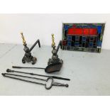 A PAIR OF HEAVY CAST IRON FIRE DOGS AND THREE FIRESIDE TOOLS PLUS A STAINED GLASS PANEL