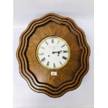 A STRIKING WALL CLOCK,