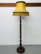 MAHOGANY STANDARD LAMP WITH TWISTED DETAIL ON 3 BUNN FEET, MUSTARD COLOURED SHADE,