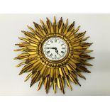 A SUNBURST WALL CLOCK