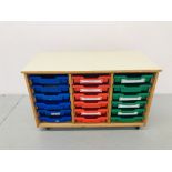 A WHEELED UNIT CONTAINING 18 PLASTIC STORAGE DRAWERS SIZE L103cm, H65cm,