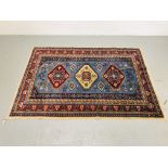 A BLUE/RED PATTERNED EASTERN RUG 1.9m x 1.