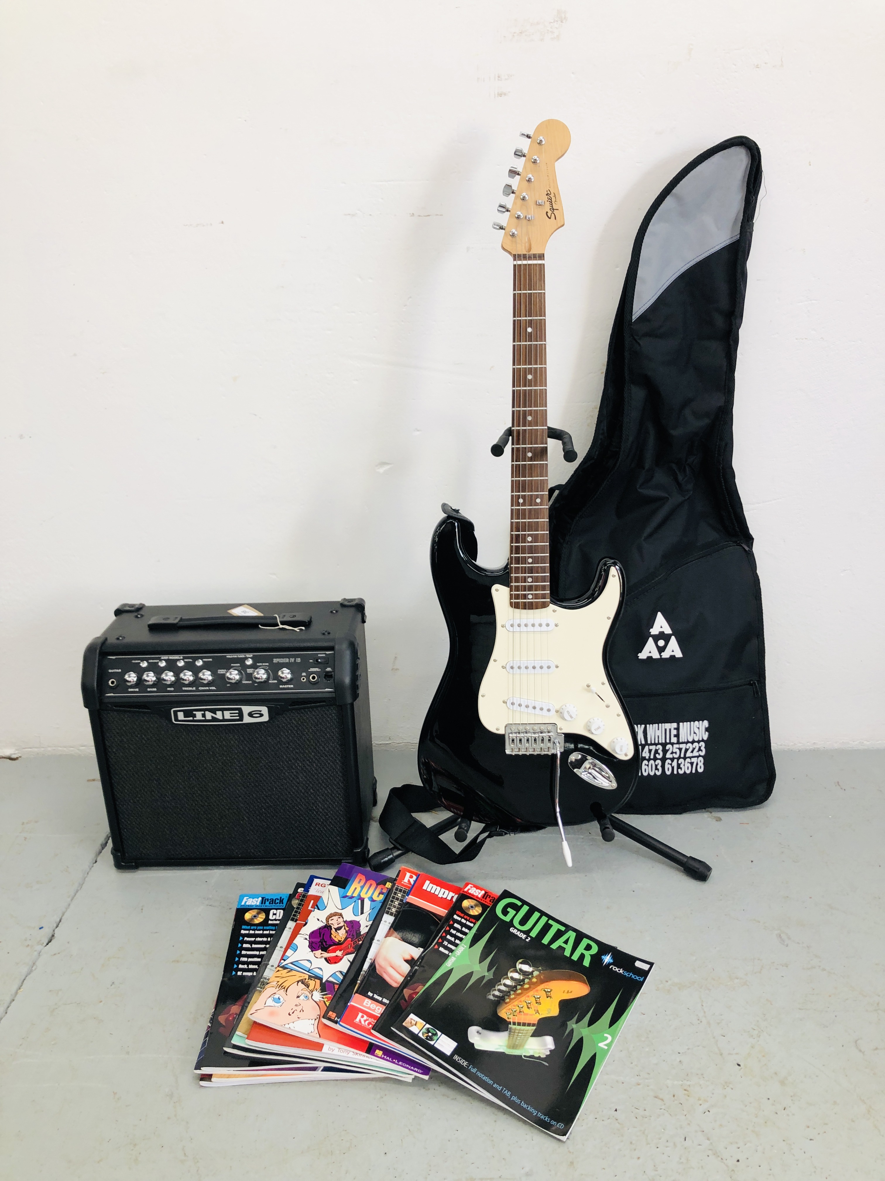 FEND SQUIER ELECTRIC GUITAR WITH A STAND & GUITAR BOOKS + LINE 6 AMP SPIDER IV 15 - SOLD AS SEEN