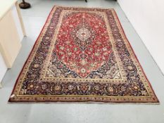 A RED/BLUE PATTERNED EASTERN CARPET, 3.