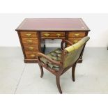 AN EDWARDIAN MAHOGANY NINE DRAWER KNEEHOLE DESK WITH BURGANDY TOOLED LEATHER TOP, WIDTH 123CM,