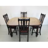 VINTAGE SOLID OAK EXTENDING DINING TABLE WITH SPARE LEAF TOGETHER WITH A SET OF 4 CHAIRS CARVED
